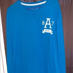 Size large with writing on sleeve
